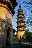 Dating from the Northern Song Dynasty (960-1127), Suzhou’s Twin Pagodas (Shuang Ta, Shuangta) are tall, narrow identical, seven-storey octagonal brick structures. One is named ‘Clarity Dispensing Pagoda’, and the other “Beneficence Pagoda’.<br/><br/>Suzhou, the city of canals and gardens, was called the ‘Venice of the East’ by Marco Polo. An ancient Chinese proverb states: ‘In Heaven there is Paradise; on Earth there is Suzhou’.<br/><br/>The city’s love affair with gardens dates back 2,500 years and continues still. At the time of the Ming dynasty (1368–1644) there were 250 gardens, of which about a hundred survive, although only a few are open to the public.